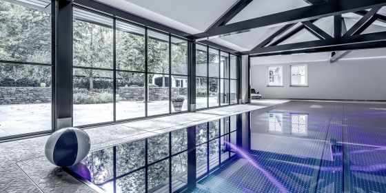 Stainless-steel pool and electrically operated window in floor